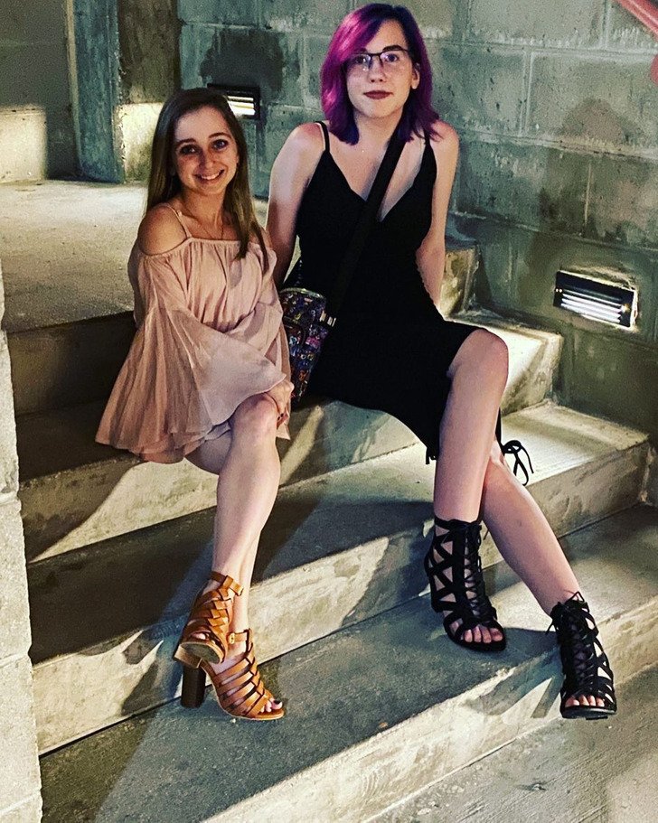 Shauna Rae smiling on steps during a night out with her sister
