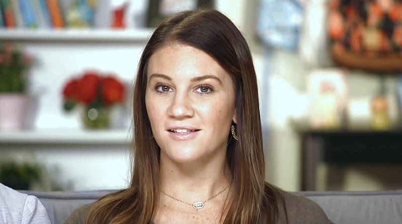 Danielle Busby smiling in a confessional