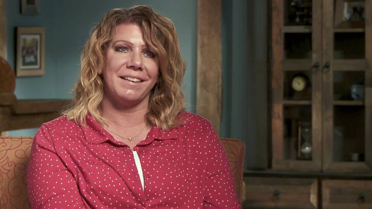 Meri Brown smiling in a confessional interview