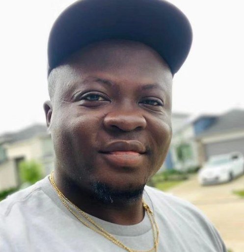Michael Ilesanmi in a candid outdoor selfie
