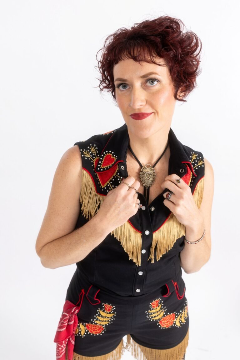 Andi Jane in a western fringed outfit