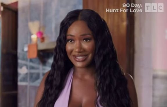 Brittany Banks smiling in a confessional