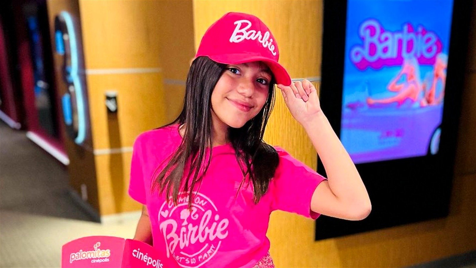 Hannah Rubio smiling in a pink Barbie outfit