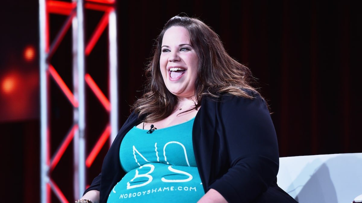 Whitney Way Thore laughing at an early No Body Shame event