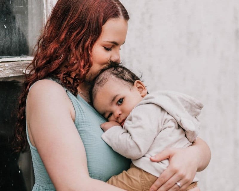 Lilly Bennett kissing her baby