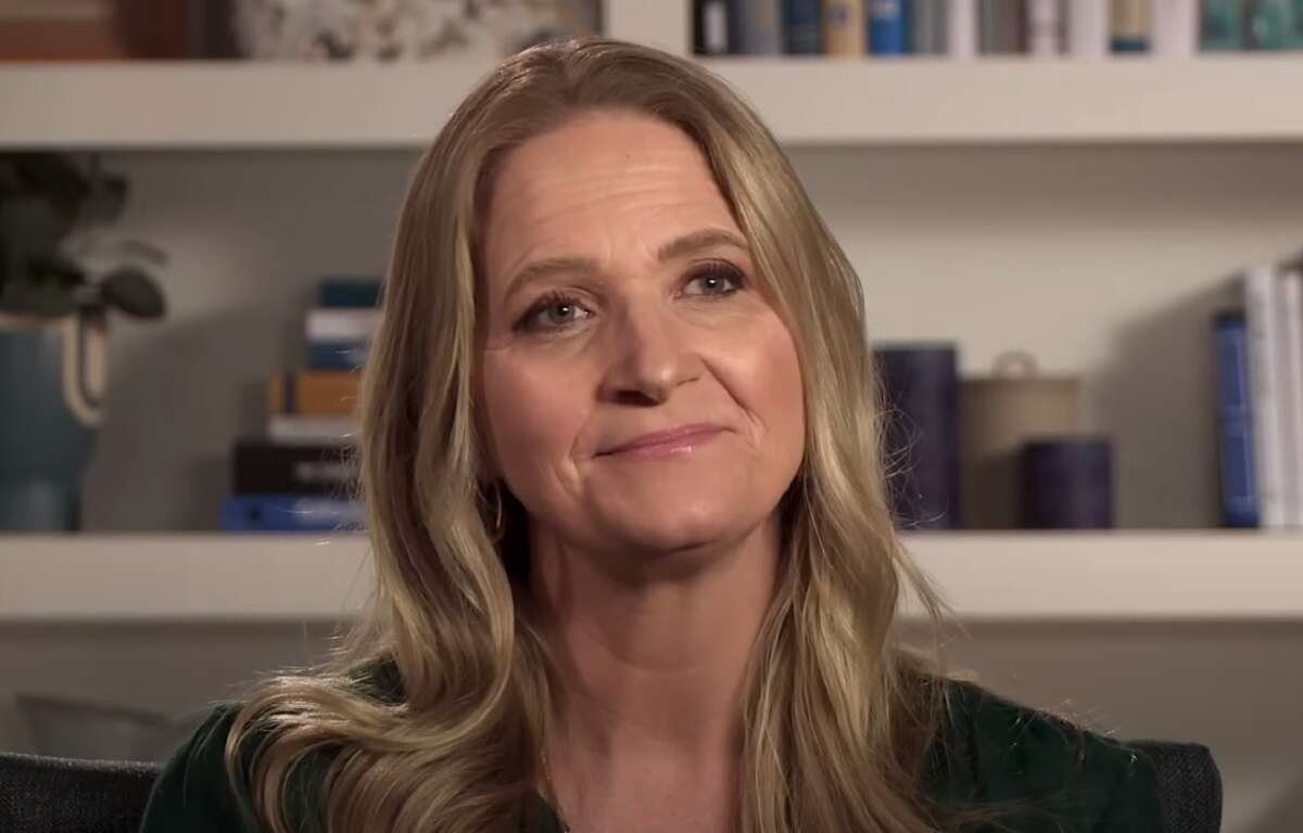 Christine Brown smiling in a confessional interview