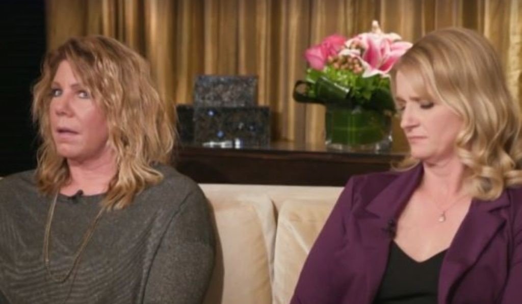 Meri Brown and Christine Brown sitting together looking tense on a couch