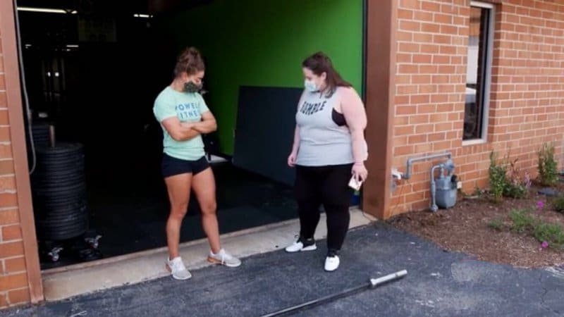Jessica Powell and Whitney Thore standing outside a gym