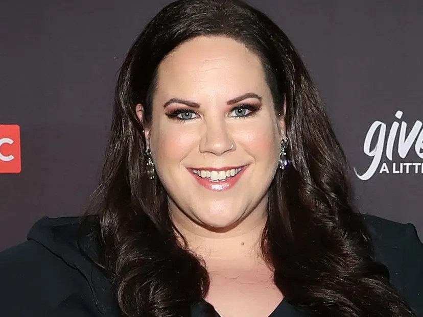 Whitney Thore smiling in a solo portrait