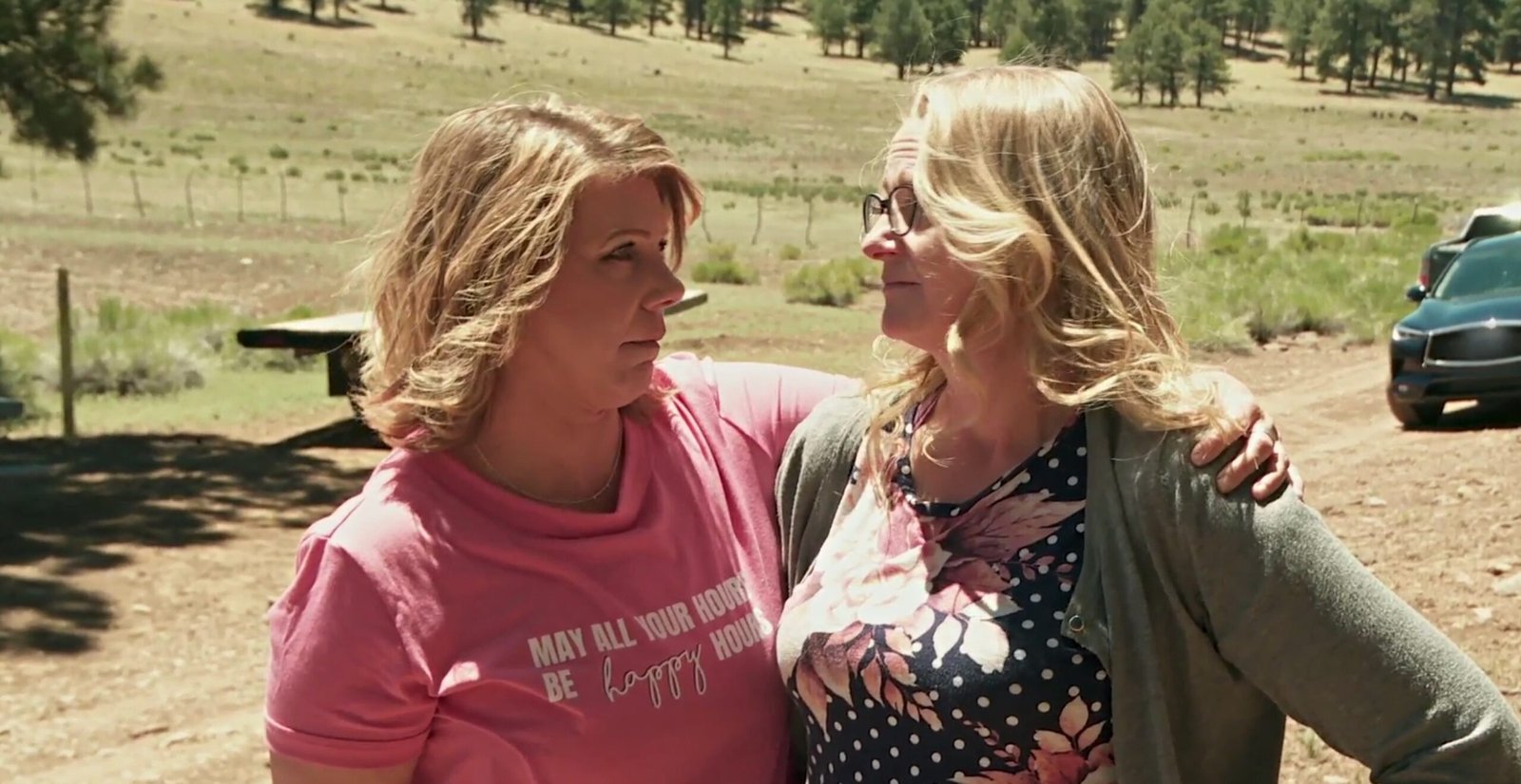 Meri Brown and Christine Brown talking outdoors