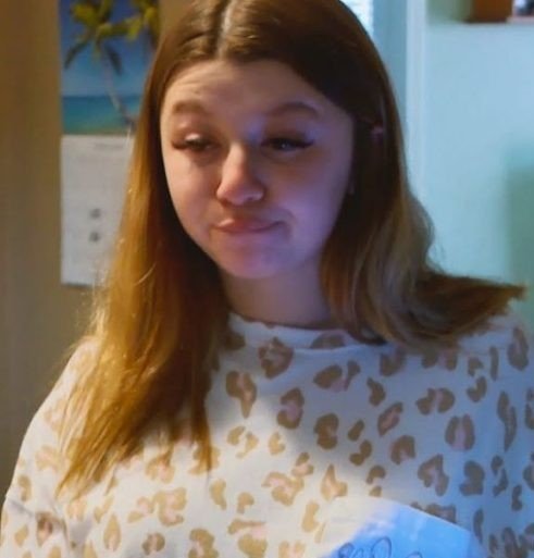 Kayleigh Weathers holding a sonogram photo