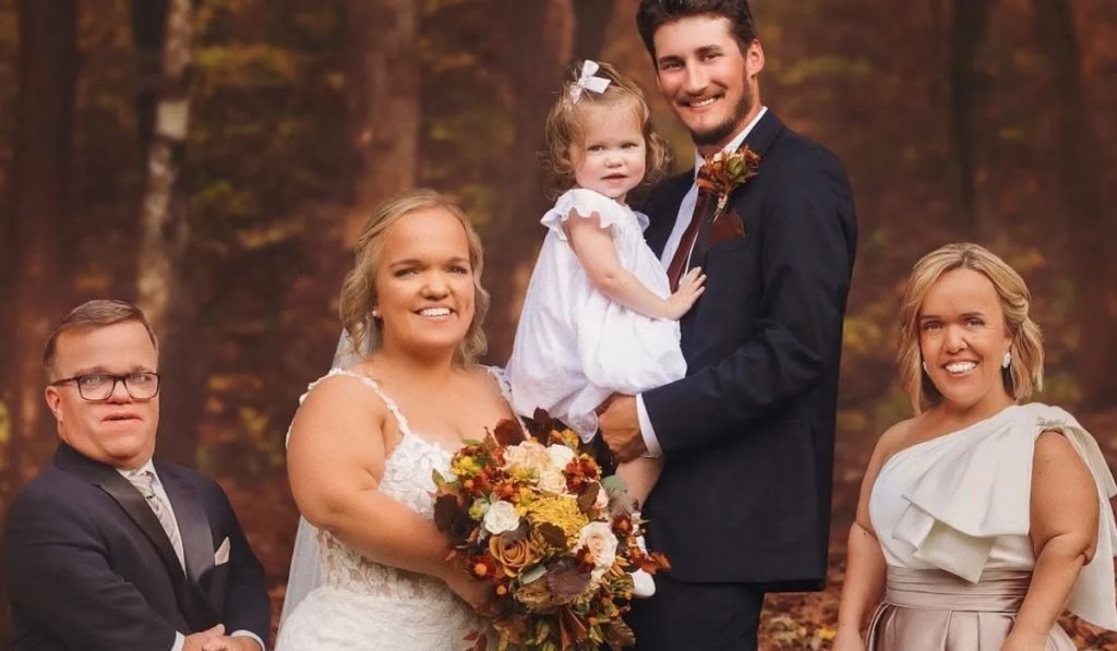 Liz and Brice on their wedding day with Leighton as flower girl, Trent and Amber beside them