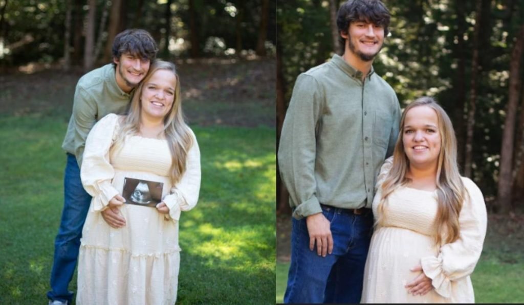 Liz and Brice in their pregnancy announcement photo, Liz holding a sonogram