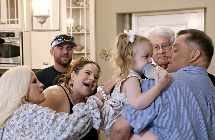 Glenn Thore with his family meeting his new grandchildren