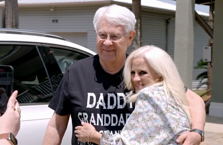 Glenn Thore hugging his long-lost daughter Angie outdoors in Alabama