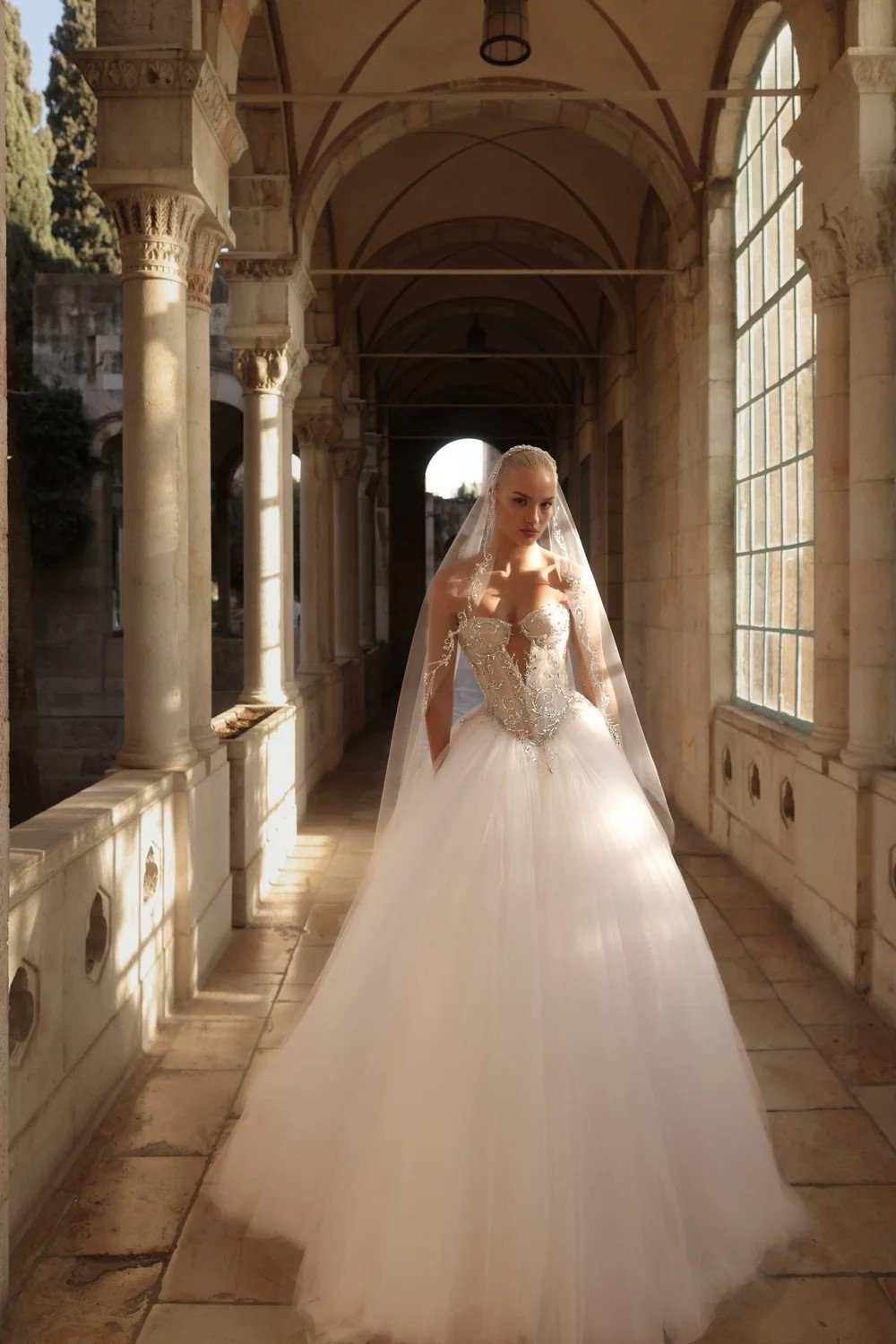 Pnina Tornai sparkle corset ball gown with cathedral veil at Kleinfeld